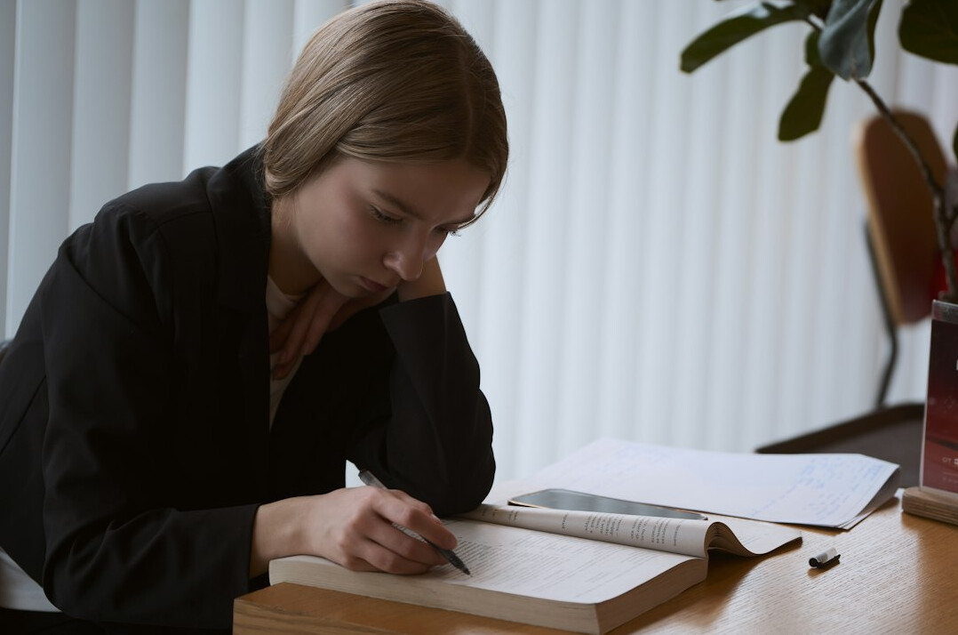 writer at desk with notebook