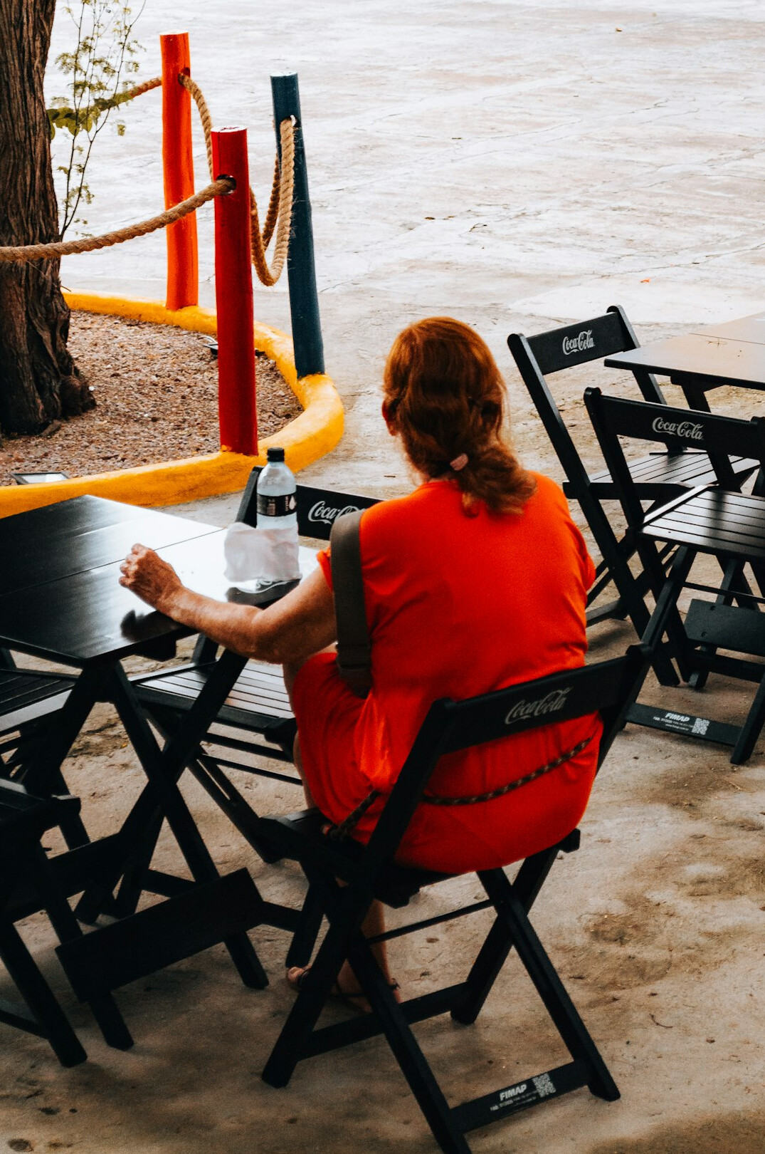 person writing in cafe